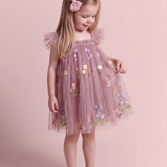 Aurora Dress in dusty mauve floral tulle, looking at the embroidered flowers