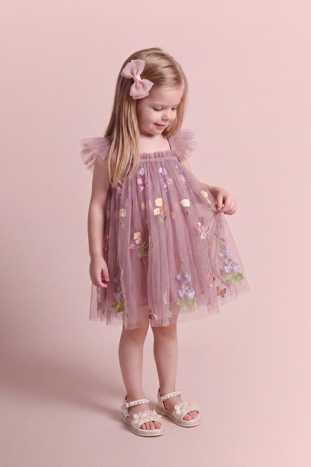 Aurora Dress in dusty mauve floral tulle, looking at the embroidered flowers