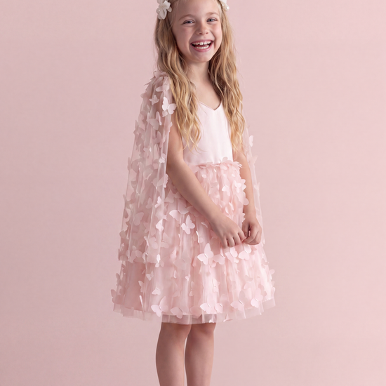 Blossom pink butterfly party dress, three quarter view showing the sheer butterfly wing panel over the shoulder