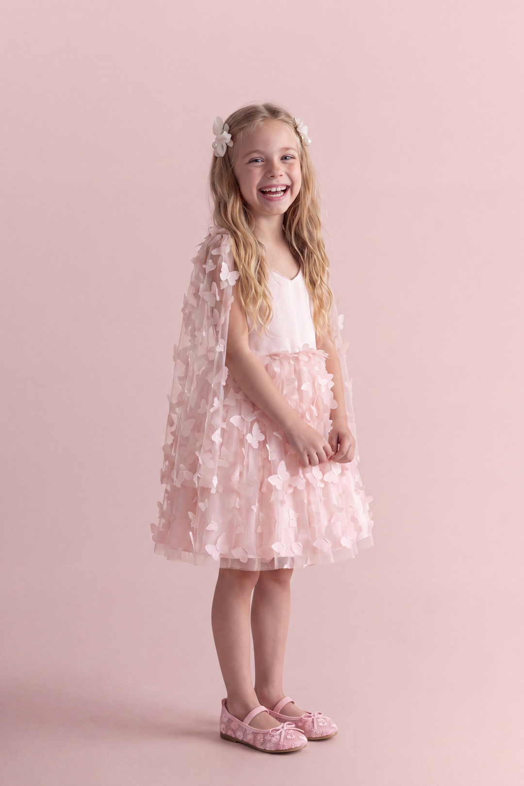 Blossom pink butterfly party dress, three quarter view showing the sheer butterfly wing panel over the shoulder