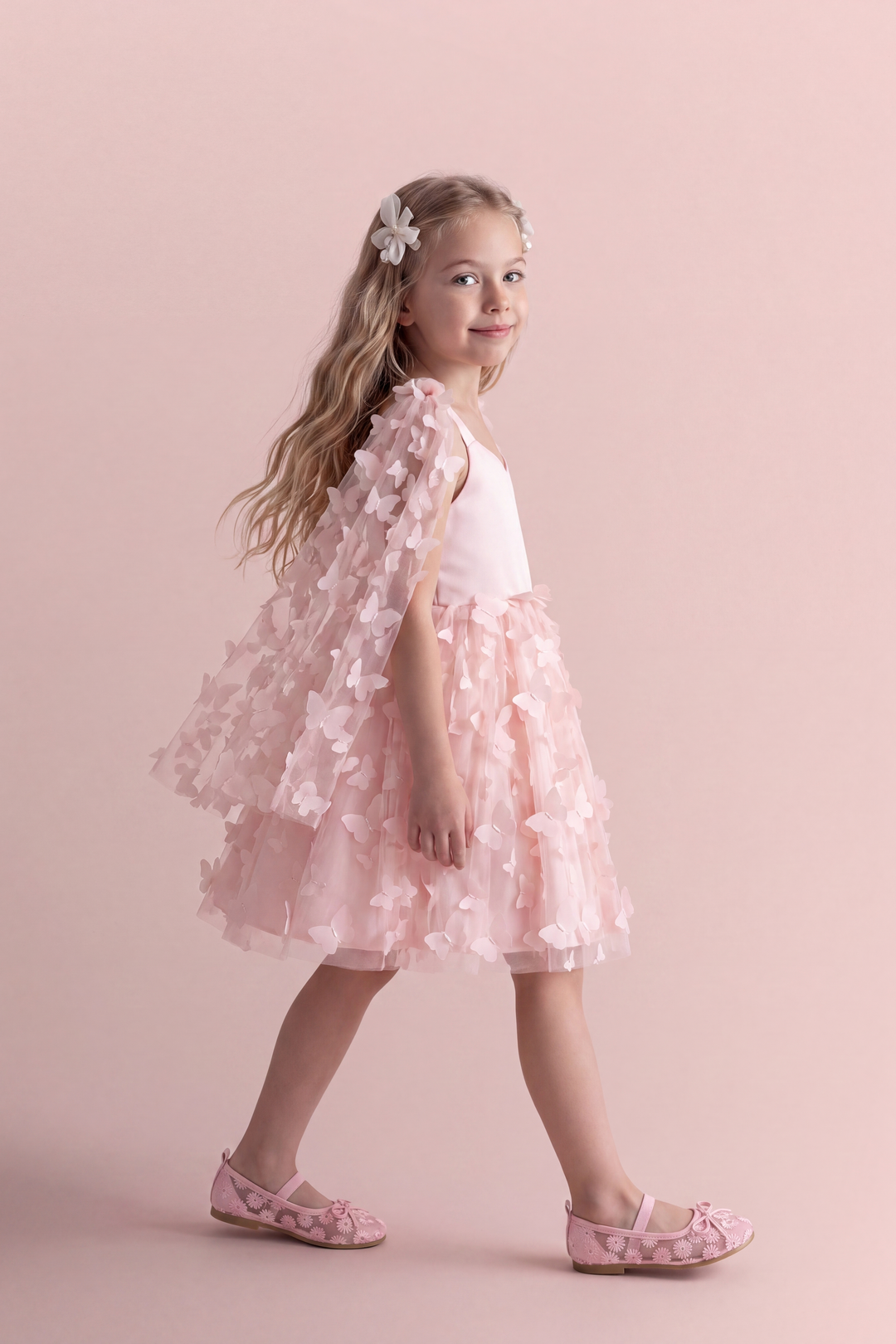 Blossom pink butterfly party dress, side view with the tulle skirt in motion