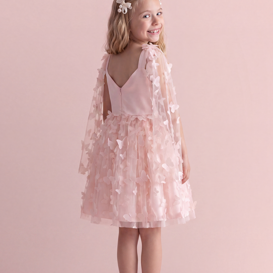 Blossom pink butterfly party dress, back view showing the low V back, satin straps and concealed zip