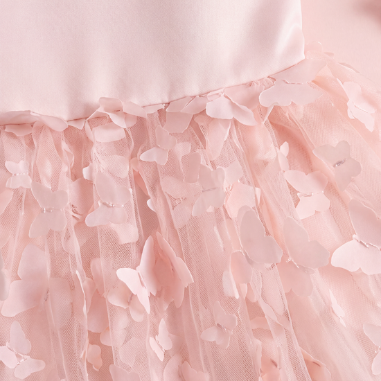 Close up of the Blossom dress waist seam and the two layer fabric butterflies lifting off the tulle
