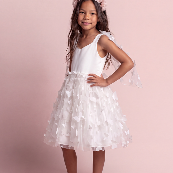 Blossom white butterfly party dress, three quarter view showing the sheer butterfly wing panels over the shoulders