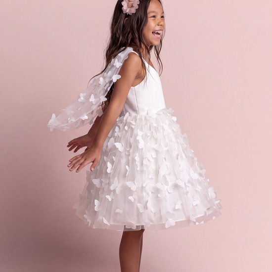 Blossom white butterfly party dress, side view with the wing panels open behind the arms