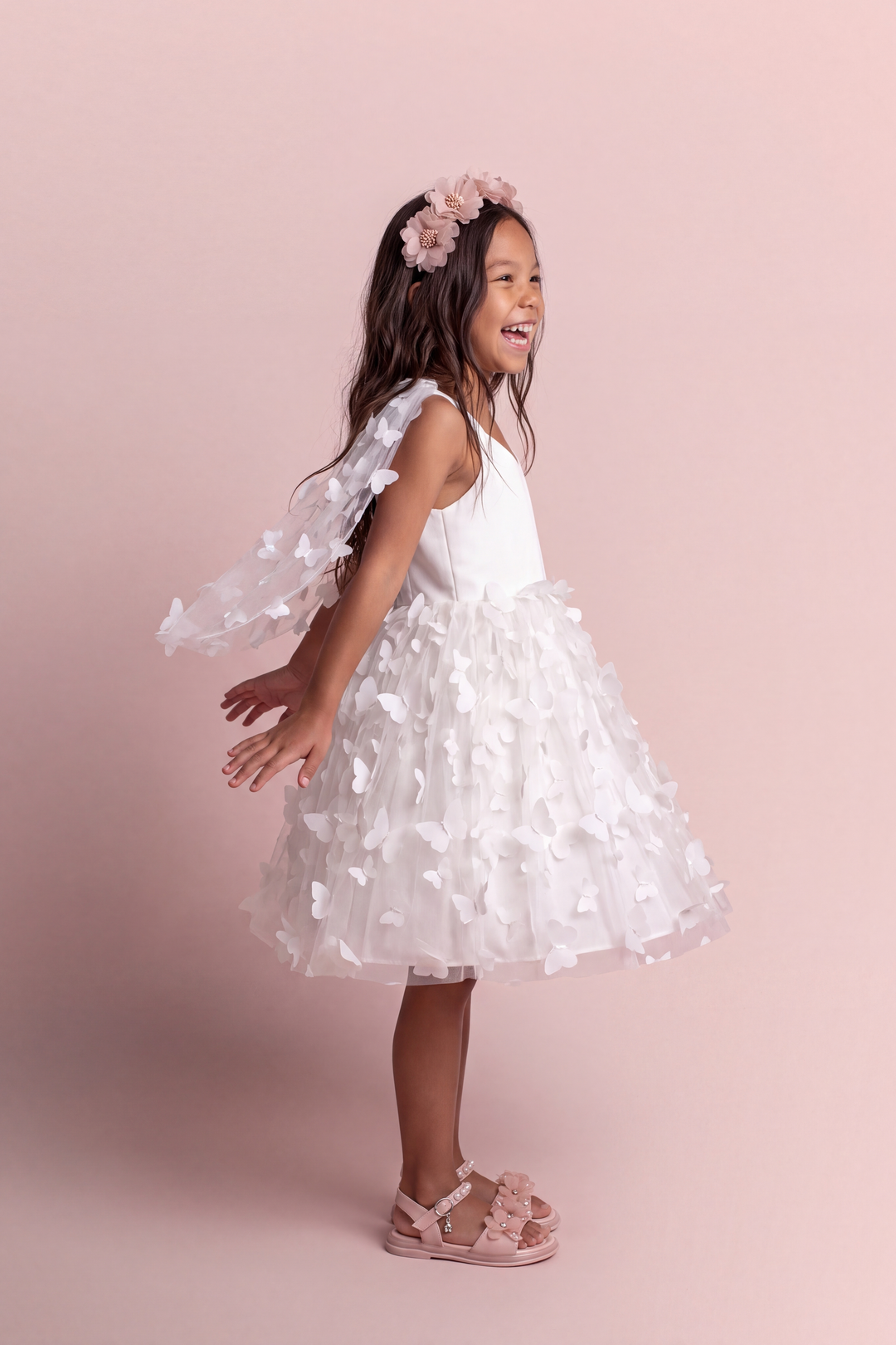 Blossom white butterfly party dress, side view with the wing panels open behind the arms