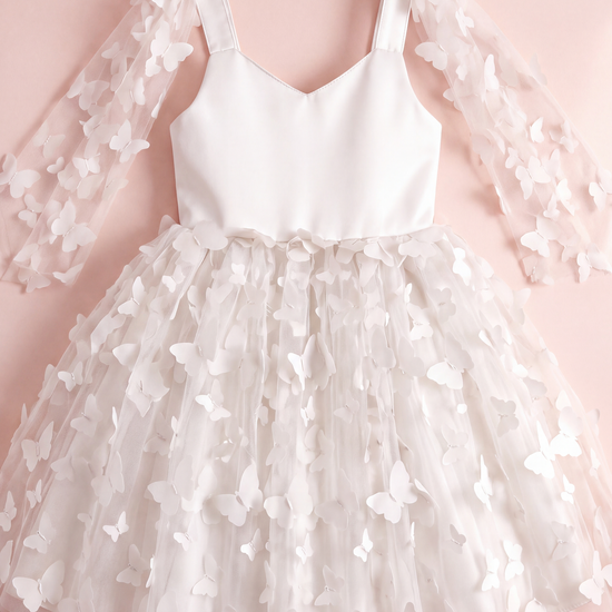 Blossom white butterfly party dress laid flat, showing the satin bodice, wing panels and butterfly tulle skirt