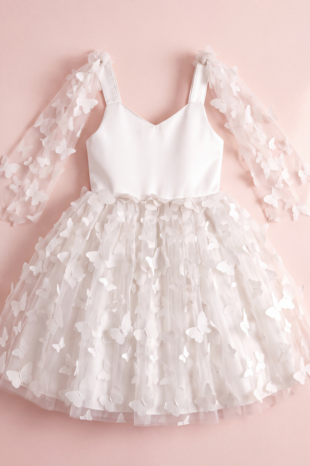Blossom white butterfly party dress laid flat, showing the satin bodice, wing panels and butterfly tulle skirt