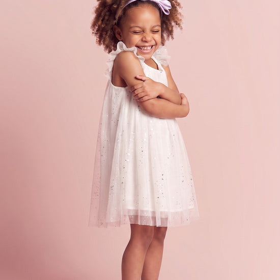 Bluebell Star Dress in white, three quarter twirl