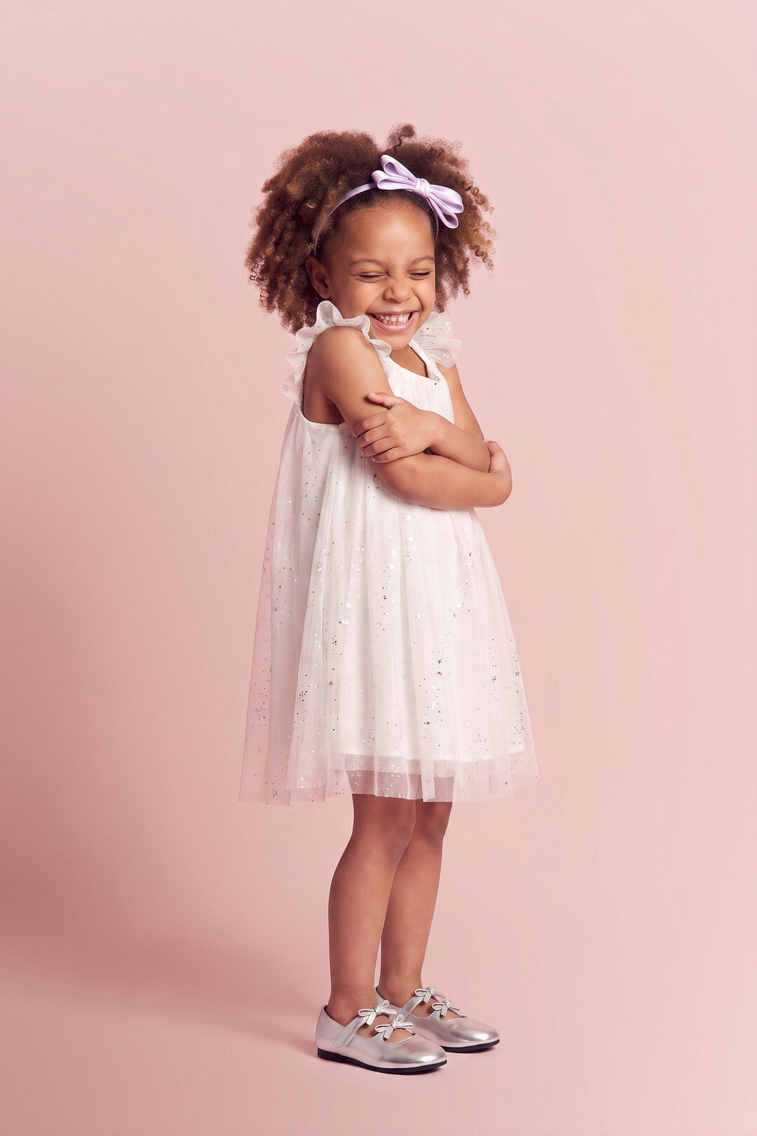 Bluebell Star Dress in white, three quarter twirl
