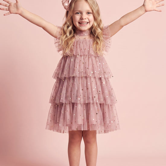 Girl wearing the Celeste Dusty Pink Flower Girl Dress, front
