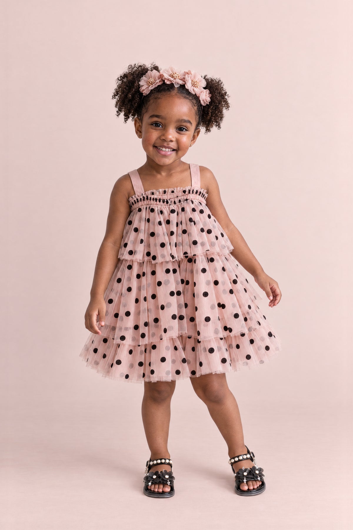 Girl wearing the Confetti Dot Blush Polka Dot Dress, front