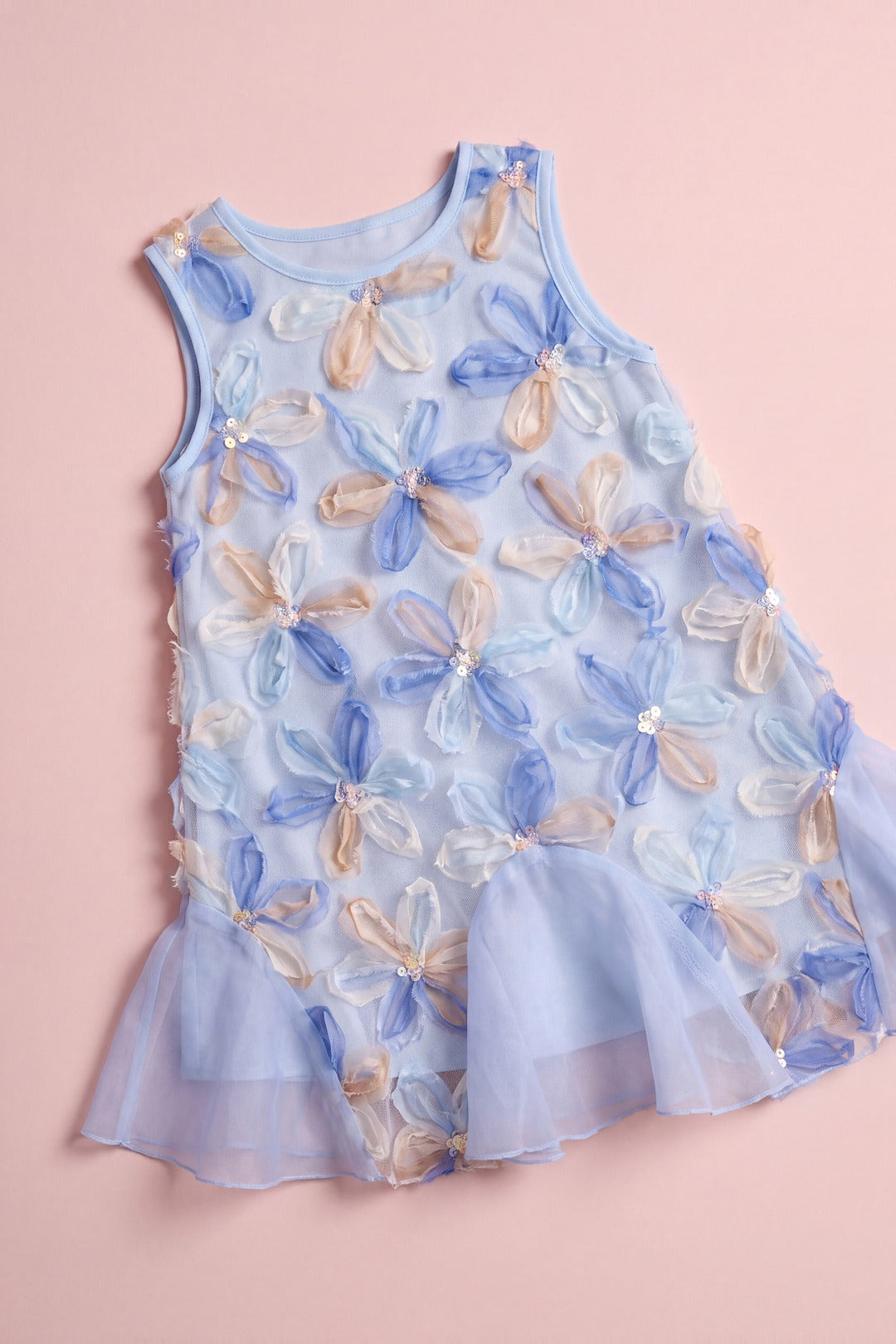 Cornflower Dress laid flat, pale blue mesh covered in applique organza flowers