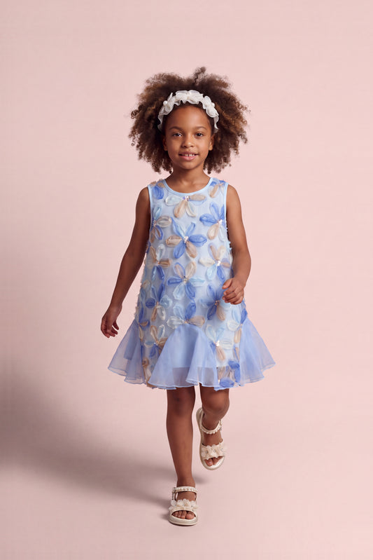 Girl wearing the Cornflower Blue Applique Flower Dress, front
