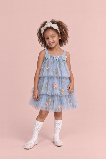 Girl wearing the Flutter Dusty Blue Butterfly Flower Girl Dress, front