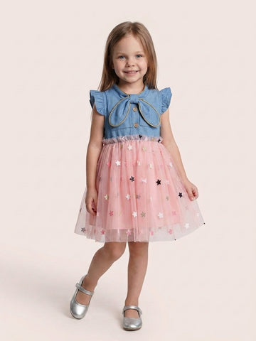 Girl in bunny ear denim star tulle dress