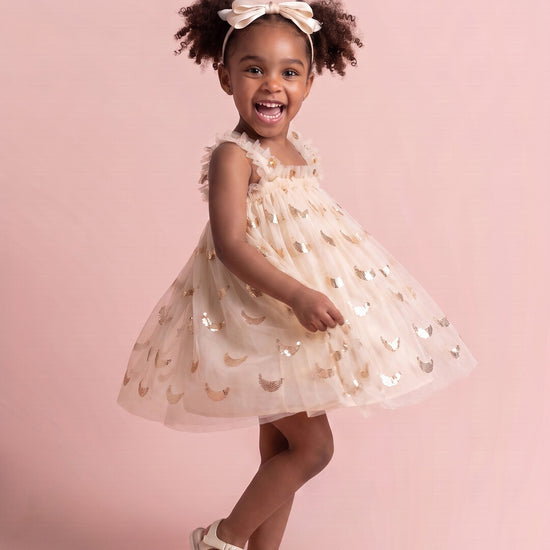 Midnight Star Dress in cream, three quarter twirl