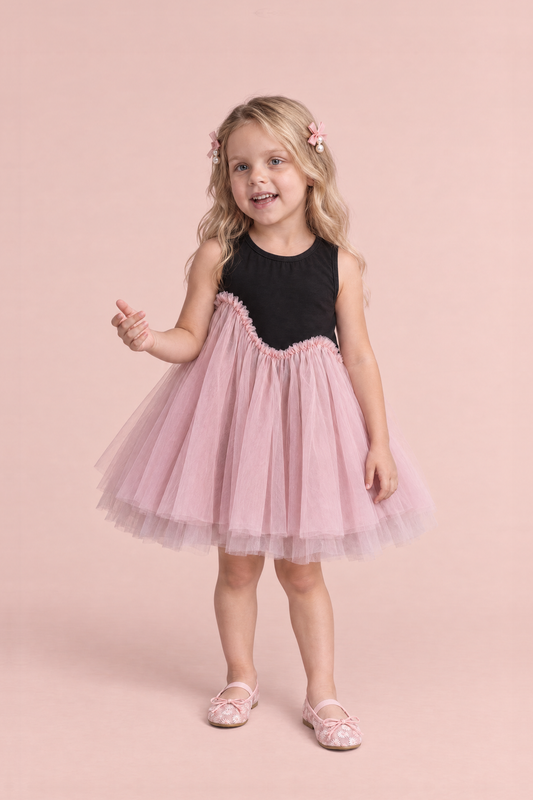Girl wearing the Odette Black and Pink Tutu Party Dress, front, chatting mid sentence