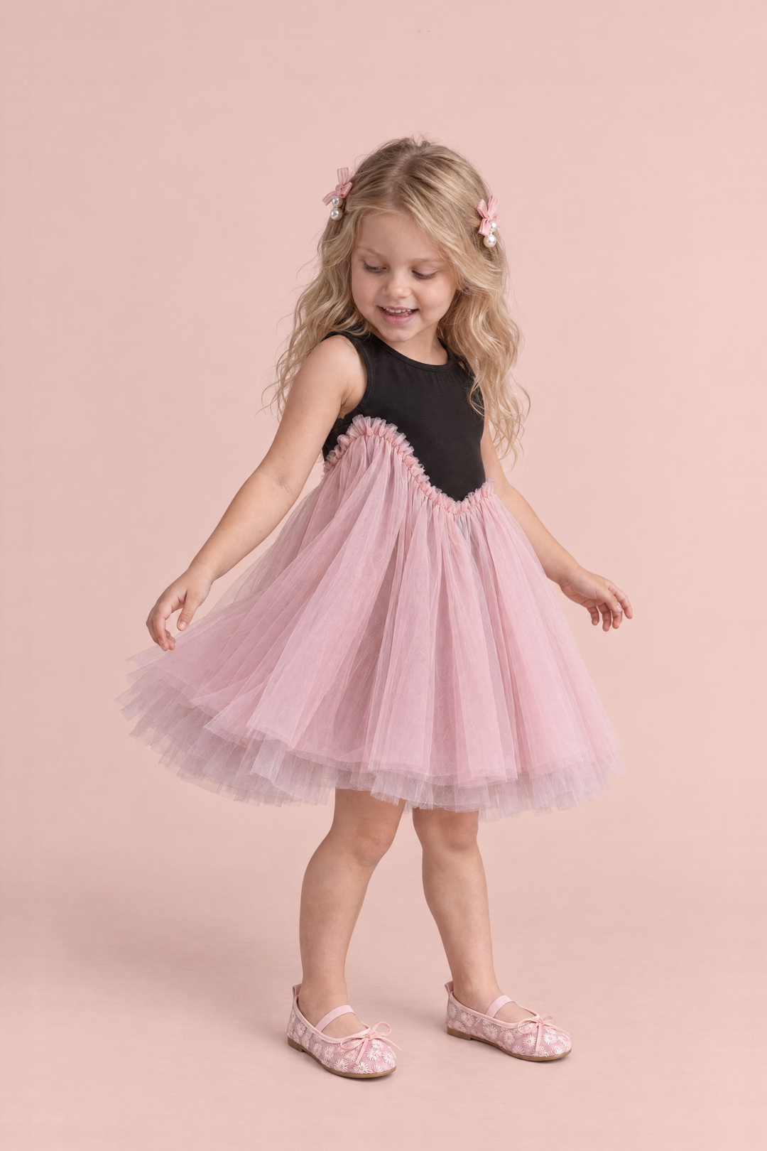 Odette Black and Pink Tutu Party Dress, three quarter view, looking down at the tutu as it swings