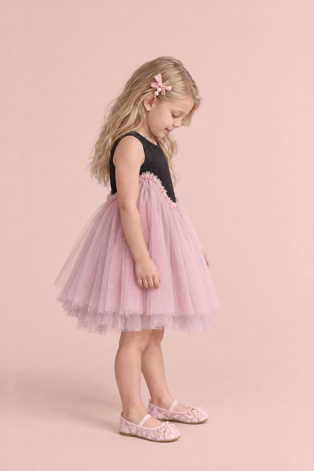 Odette Black and Pink Tutu Party Dress, side view, looking down at her ballet flats