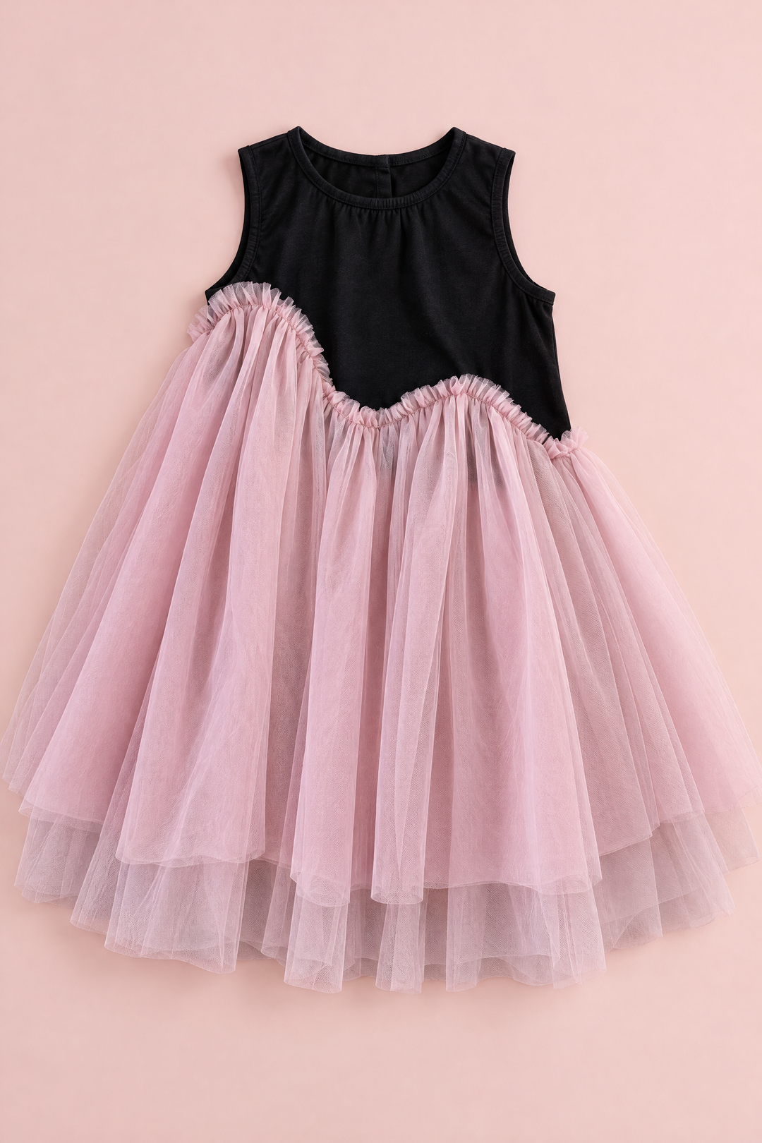 Odette Black and Pink Tutu Party Dress laid flat, showing the black top, the wave seam and the full tulle skirt