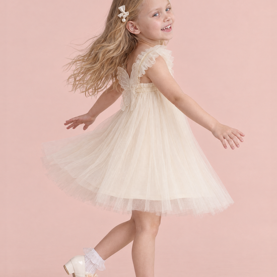 Papillon Ivory Butterfly Back Flower Girl Dress, side, mid twirl with the skirt flying