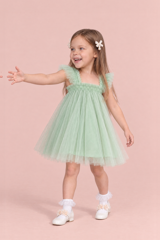 Papillon Mint Butterfly Back Flower Girl Dress, three quarter view, reaching out to the side