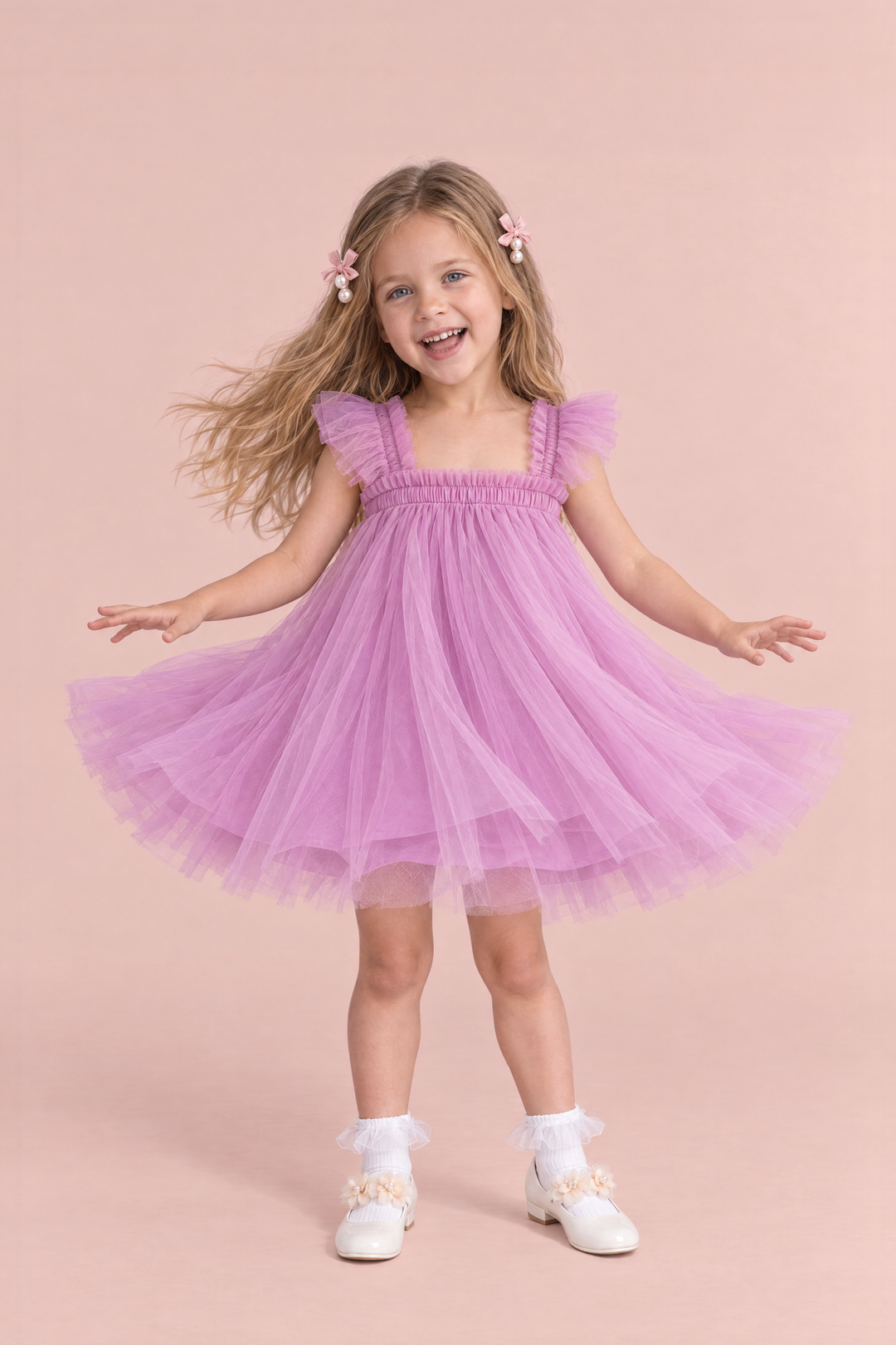 Girl wearing the Papillon Orchid Butterfly Back Flower Girl Dress, front, mid twirl with the skirt flying