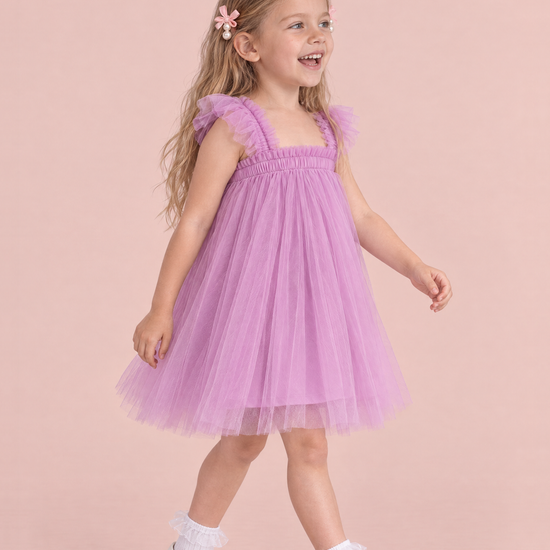 Papillon Orchid Butterfly Back Flower Girl Dress, three quarter view, walking into the light