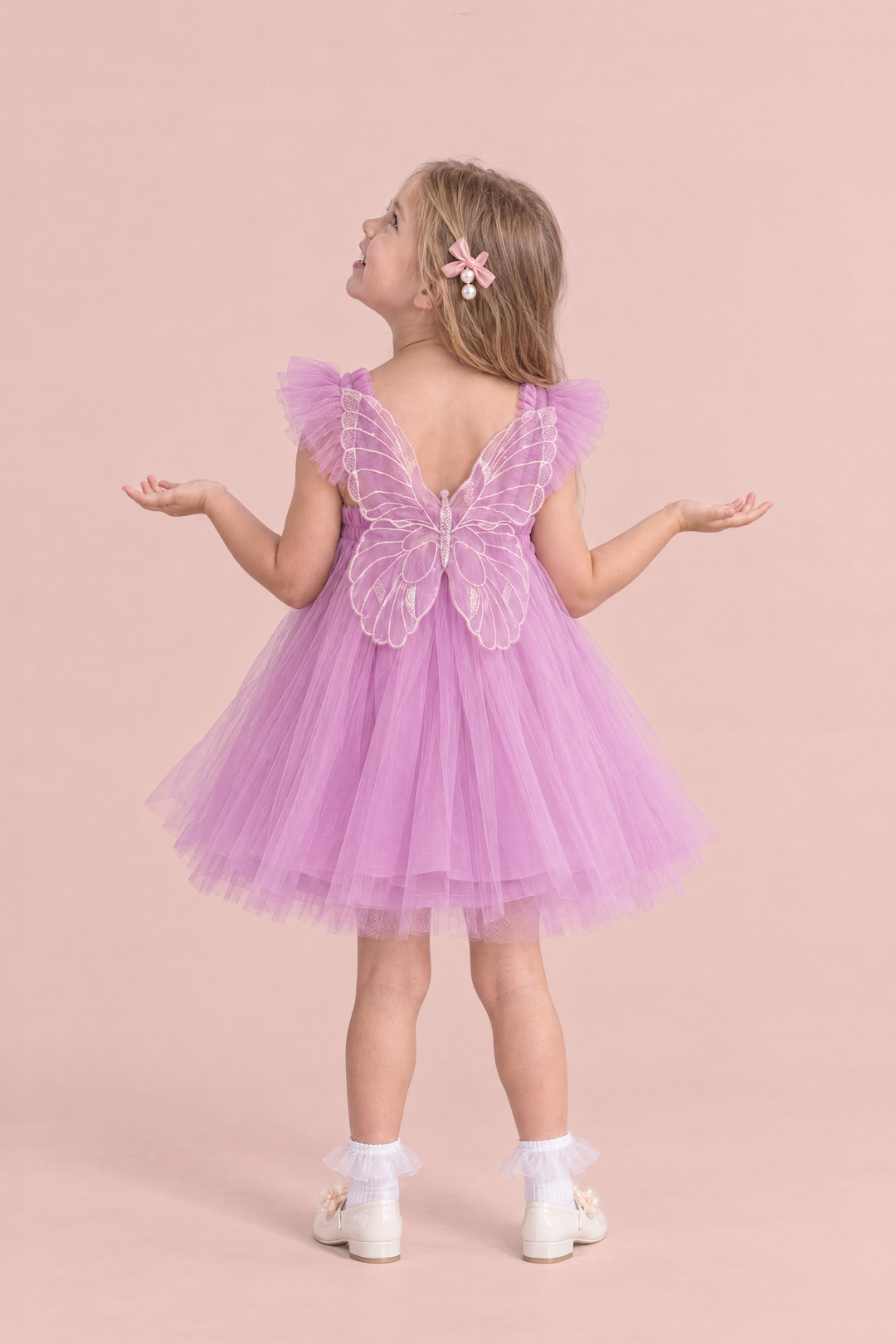 Papillon Orchid Butterfly Back Flower Girl Dress, back, palms up looking at the sky, one large organza butterfly between the straps