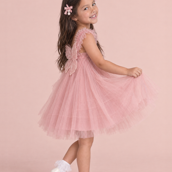 Papillon Dusty Rose Butterfly Back Flower Girl Dress, side, a curtsy with the skirt fanned out