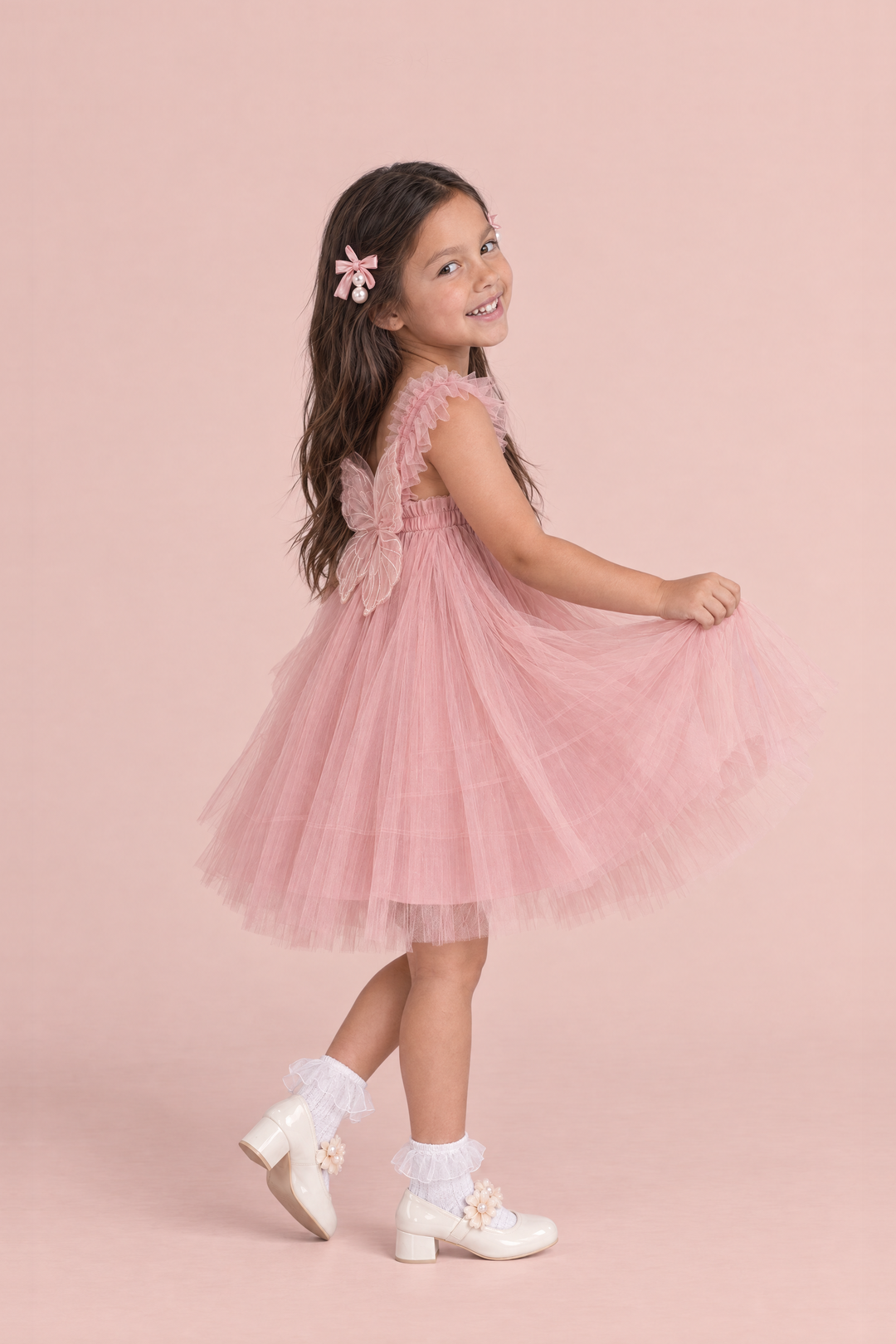Papillon Dusty Rose Butterfly Back Flower Girl Dress, side, a curtsy with the skirt fanned out
