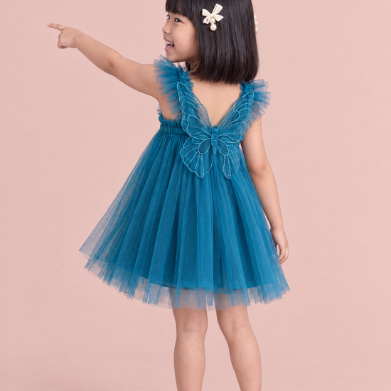 Papillon Teal Butterfly Back Flower Girl Dress, pointing ahead, the organza butterfly across her back