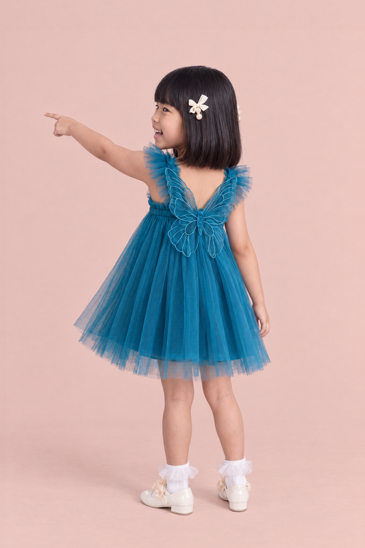 Papillon Teal Butterfly Back Flower Girl Dress, pointing ahead, the organza butterfly across her back