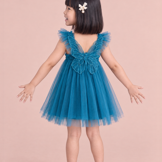 Papillon Teal Butterfly Back Flower Girl Dress, back, arms spread down and out, one large organza butterfly between the straps