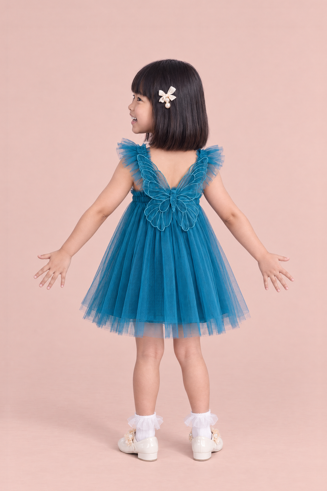 Papillon Teal Butterfly Back Flower Girl Dress, back, arms spread down and out, one large organza butterfly between the straps