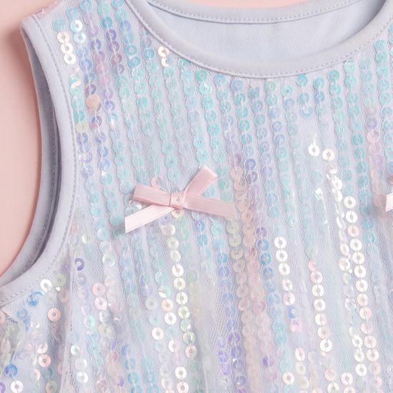 Close up of the Periwinkle dress neckline, iridescent sequins and a satin bow