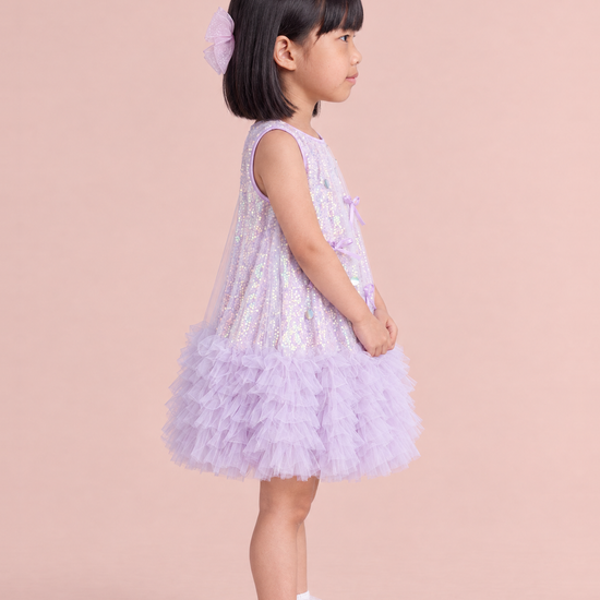 Periwinkle Lavender Sequin Party Dress, side view showing the A line swing shape and the tulle ruffle hem