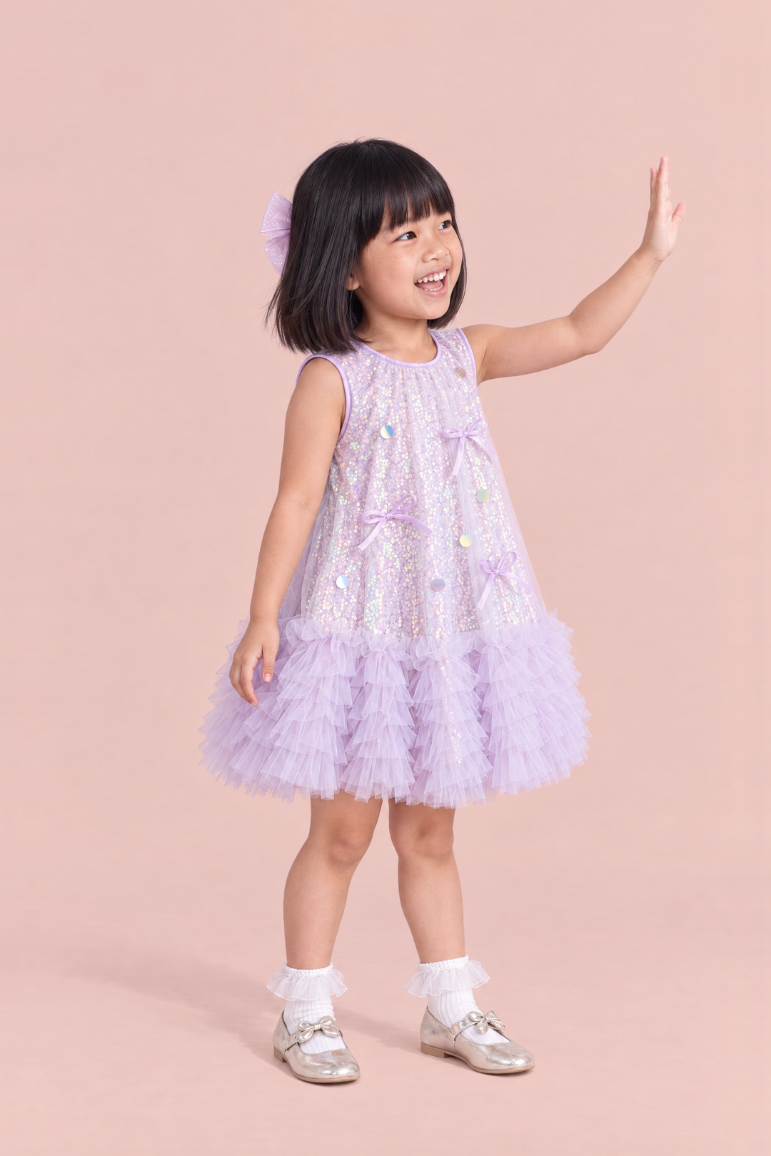 Periwinkle Lavender Sequin Party Dress, three quarter view with satin bows and sequin discs on the front