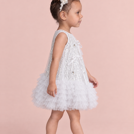 Periwinkle Silver Sequin Party Dress, side view showing the A line swing shape and the tulle ruffle hem