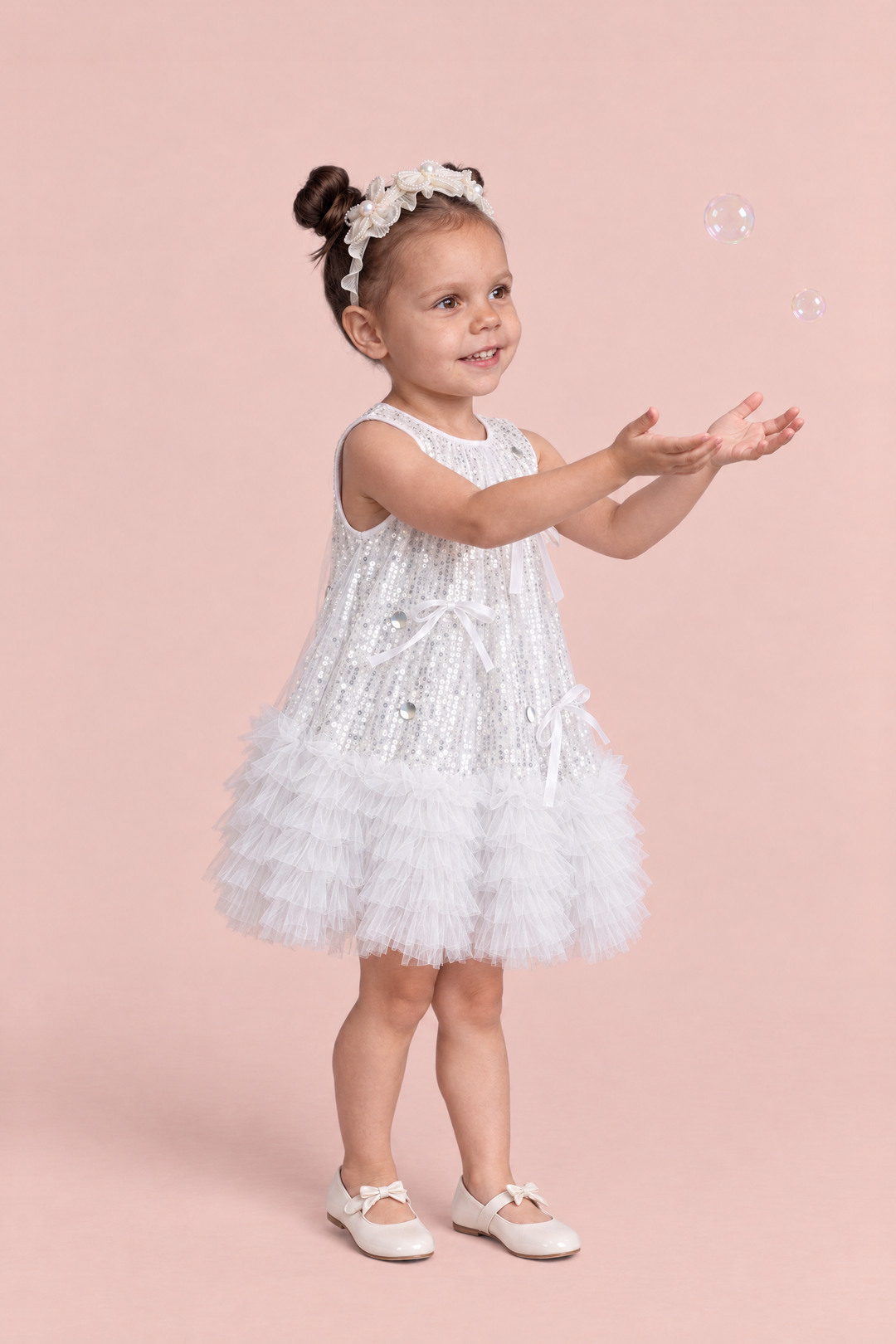 Periwinkle Silver Sequin Party Dress, three quarter view with long tailed satin bows and silver discs on the front