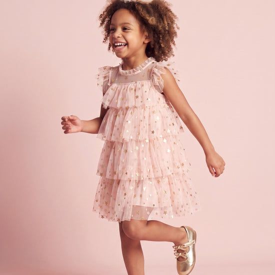 Petal Star Dress in blush pink, three quarter twirl