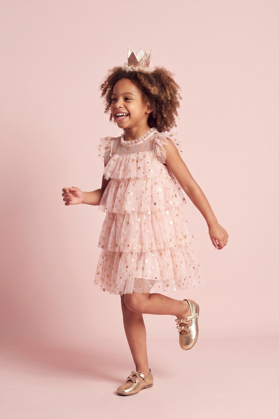 Petal Star Dress in blush pink, three quarter twirl