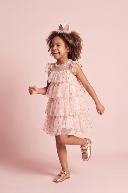 Petal Star Dress in blush pink, three quarter twirl