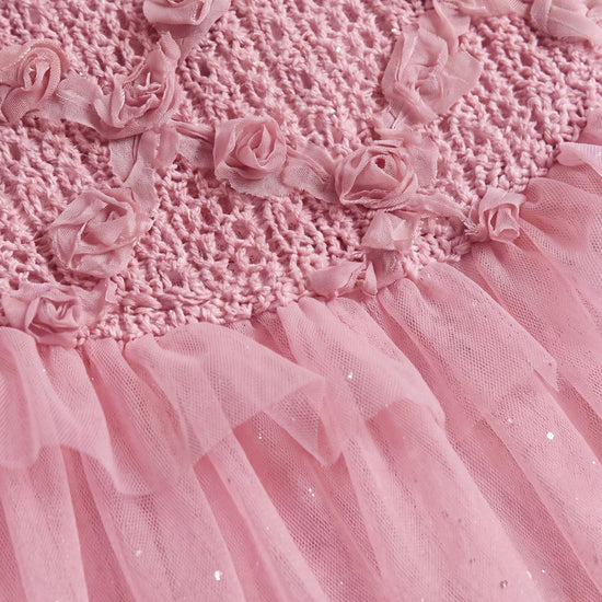 Close up of the hand twisted gauze roses, trailing stems and leaves on the crochet yoke