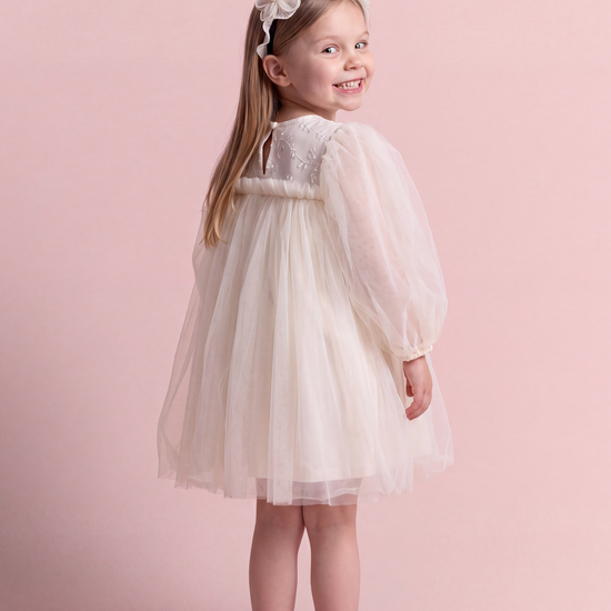 Snowdrop ivory puff sleeve party dress, back view showing the embroidered yoke and the keyhole button at the neck