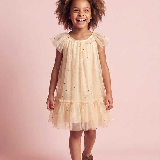 Starlight Dress in cream, three quarter twirl