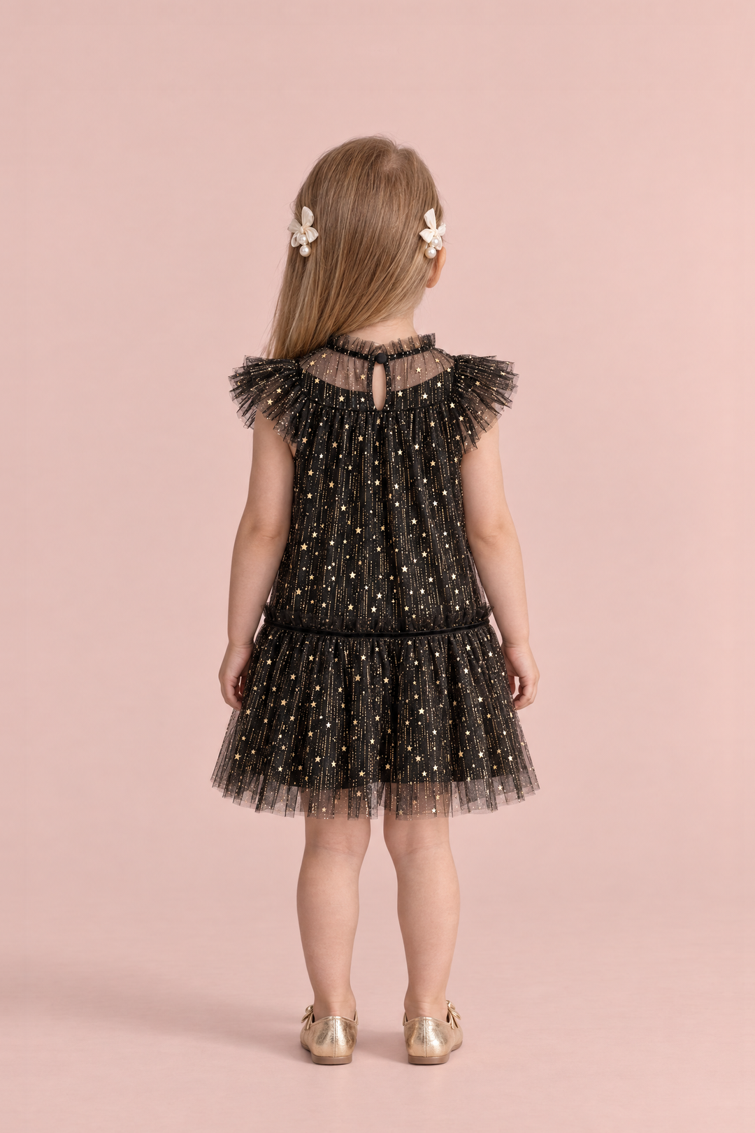 Stardust Black Star Tulle Party Dress, back view with the keyhole and button at the neck and cream pearl bow clips