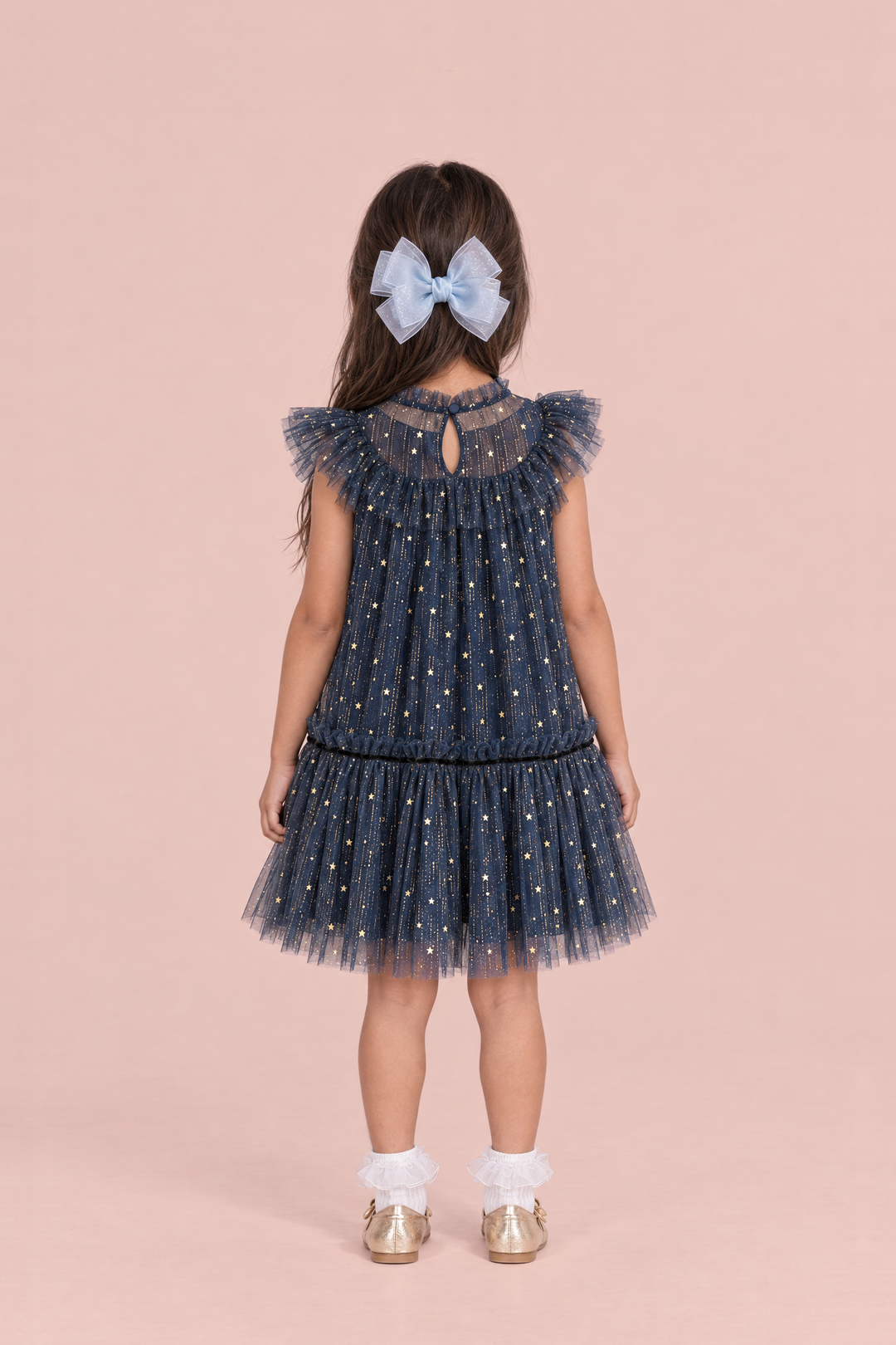 Stardust Navy Star Tulle Party Dress, back view with the keyhole and button at the neck and a pale blue bow clip