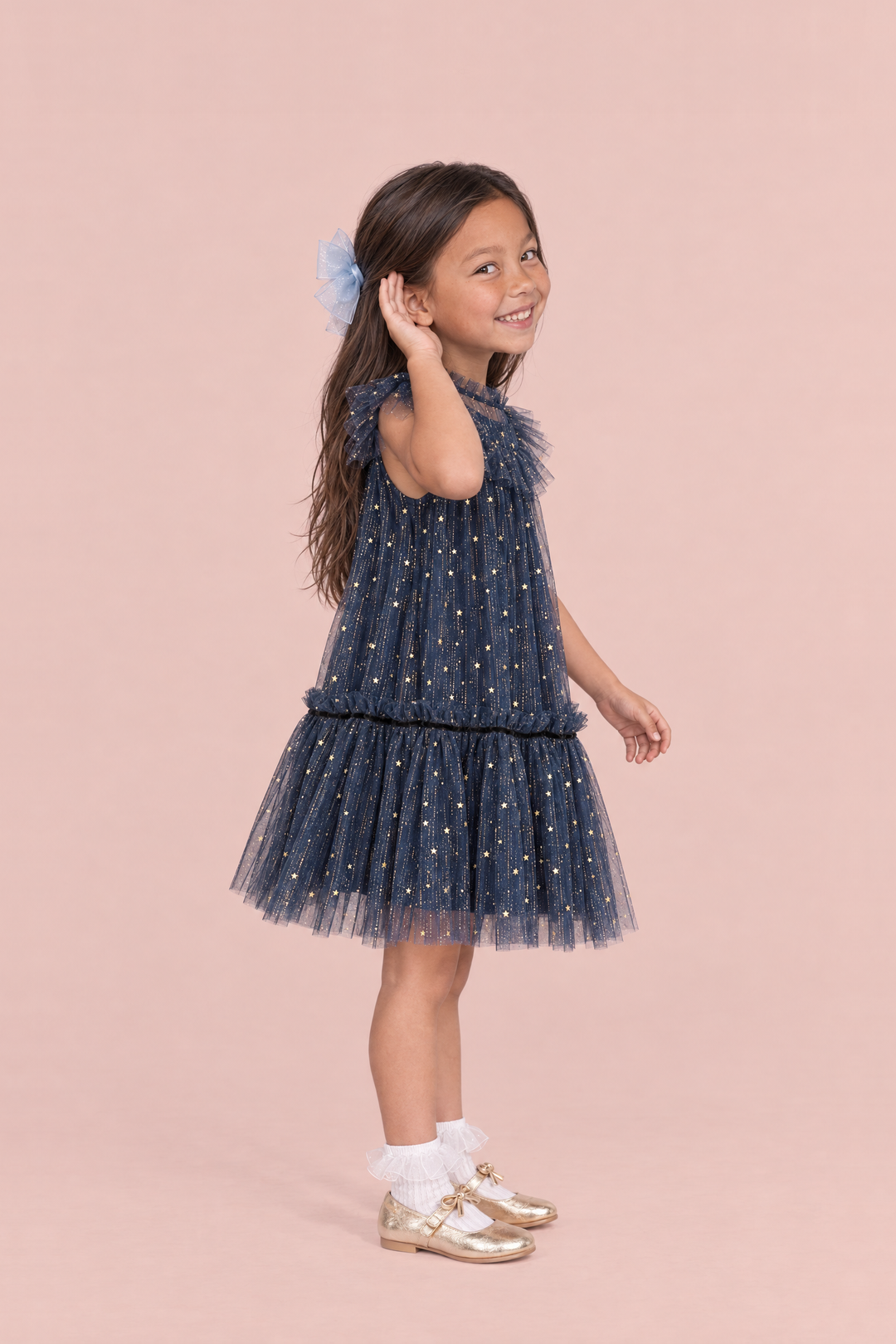 Stardust Navy Star Tulle Party Dress, side view showing the A line shape, the flutter sleeve and the tulle skirt